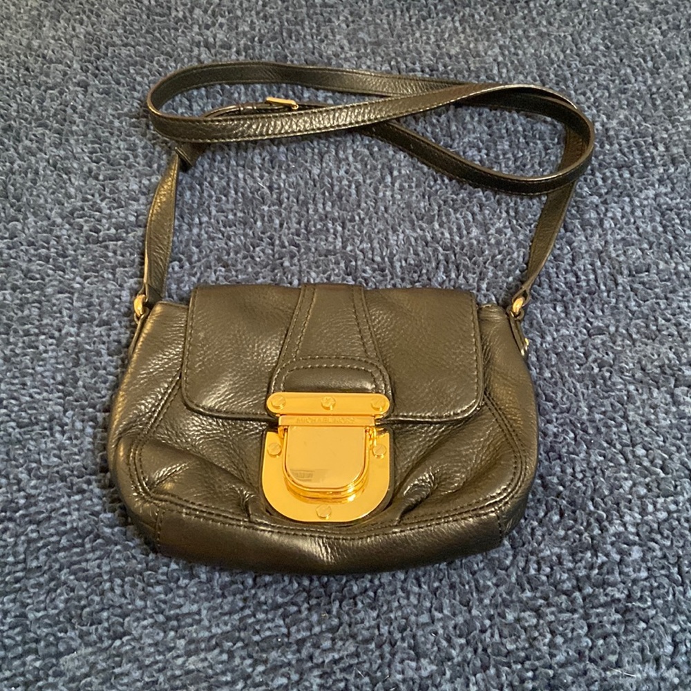 Michael Kor’s Mini Black Leather and Gold Purse